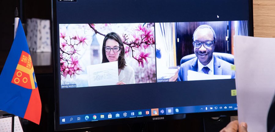 Wendy Wolford and University of Pretoria Vice Chancellor Tawana Kupe formalize an institutional agreement during a virtual MOA signing ceremony