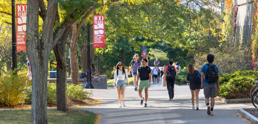 Students walking on campus in the spring