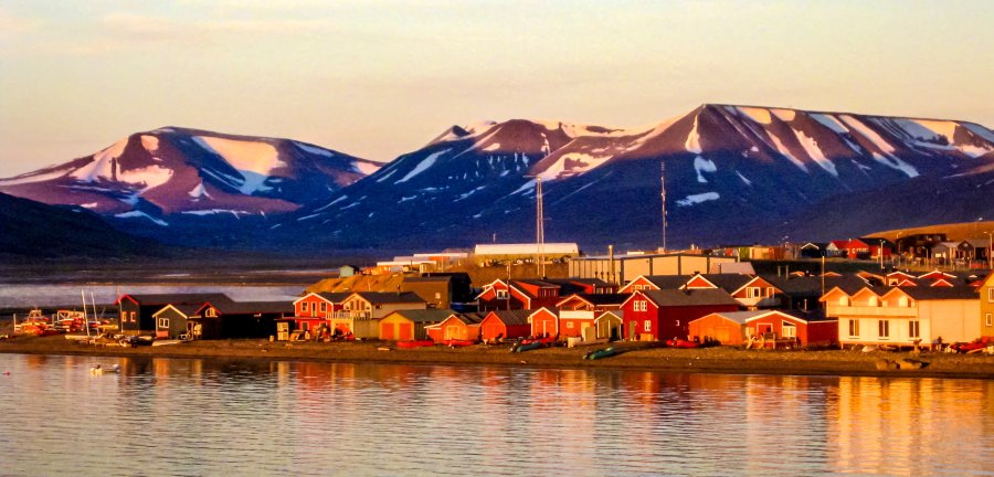 Midnight sun on the Longyearbyen waterfront in Svalbard in the Norwegian Arctic