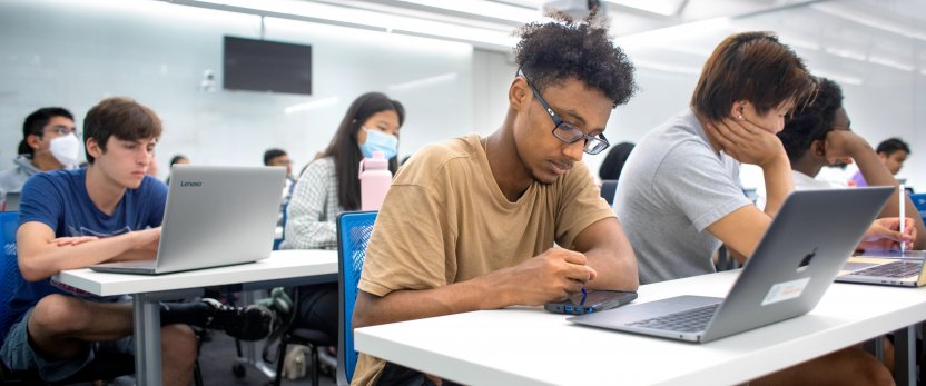 Students sitting in rows in a classroom.