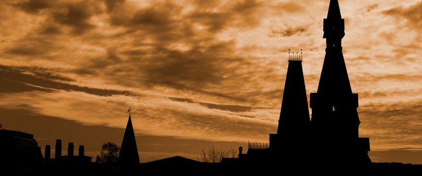 Sage Hall at sunset, with clouds