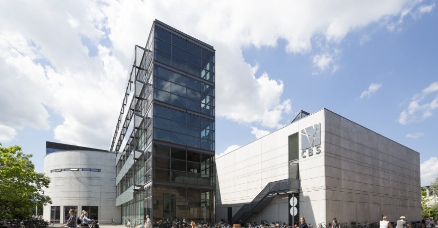 Buildings with a dense row of bicycles parked in front