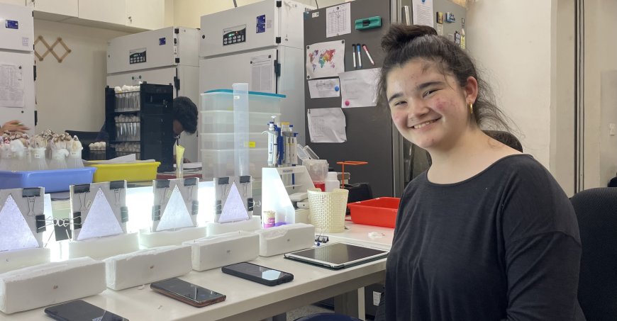 Haruna at a lab table working on a project. 