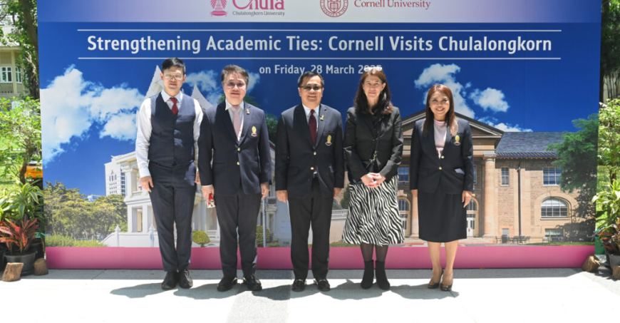 Five people including Wendy Wolford and the Chula president standing in front of a banner that reads "Strengthening Academic Ties: Cornell Visits Chulalongkorn."