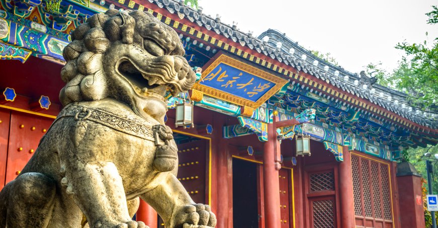 Chinese guardian lion. Located in west gate of Peking University, Beijing, China.