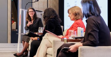 Wendy Wolford sitting ona apel with three other speakers.