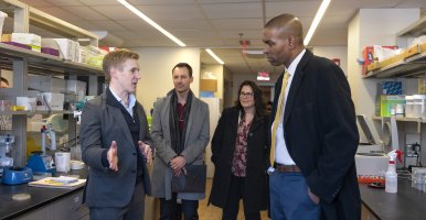 New York Lt. Gov. Antonio Delgado, right, listens to Buz Barstow, assistant professor of biological and environmental engineering, describe how microbes can dissolve rocks to obtain rare earth elements. Credit: Jason Koski