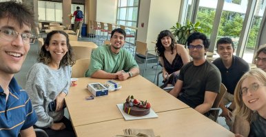 Owen Brook (left) with fellow graduate students studying engineering.