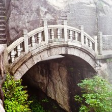 View of a stone bridge in the mist. 