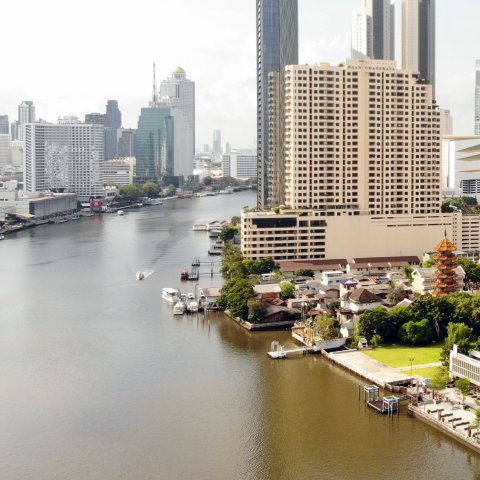 Cityscape with river running through.