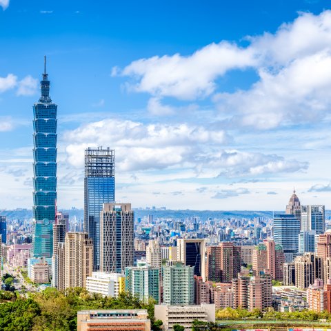 Cityscape of Taipei with skyscraper under dramatic clouds at blue sky in Taiwan.