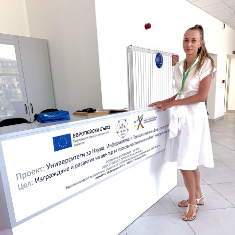 Svitlana Turlakova standing near a desk.